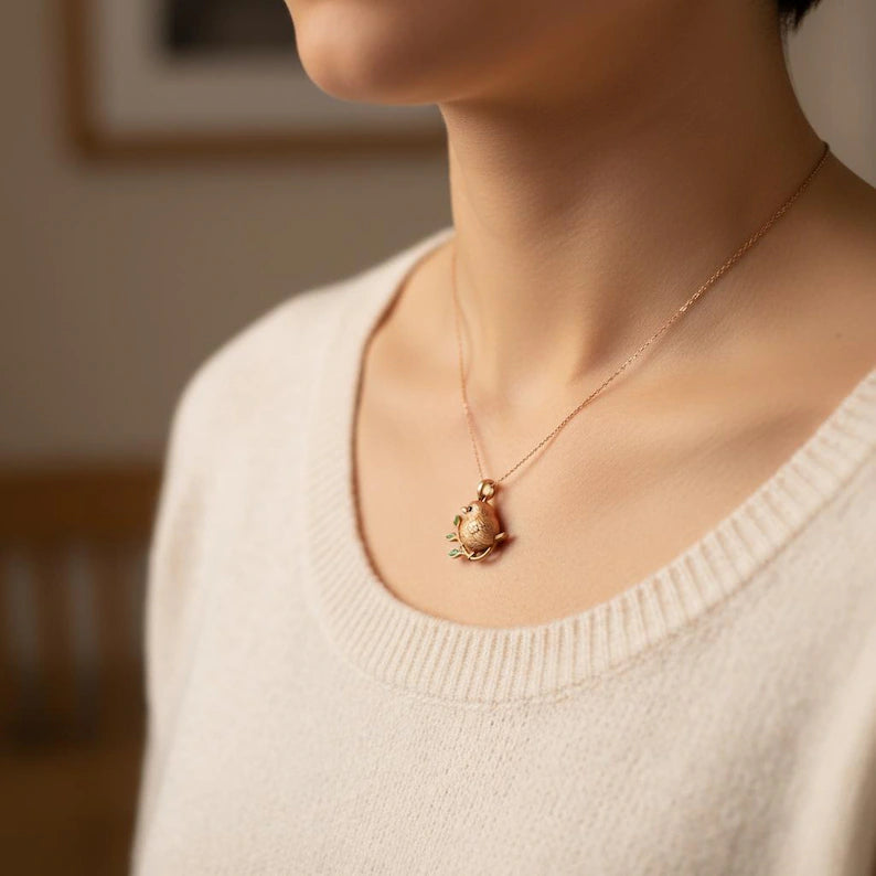 Handcrafted Bird Pendant Necklace: Bronze Sparrow with Green Enamel Leaves